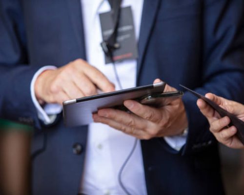 Filling checklist form on digital tablet