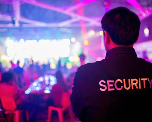 Security guard  are regulating the situation of safety in an event concert in a nightclub.